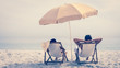 People relaxing and reclining on deck chairs