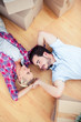 Young couple relaxing on the wooden floor