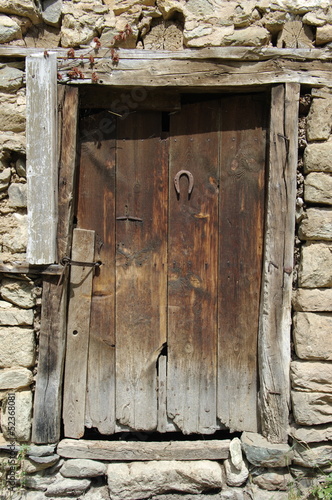 Rusty Horseshoe On Rustic Door