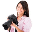 Woman looking at pictures on the camera