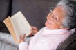 Old woman reading a book