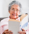 Retired woman reading a book