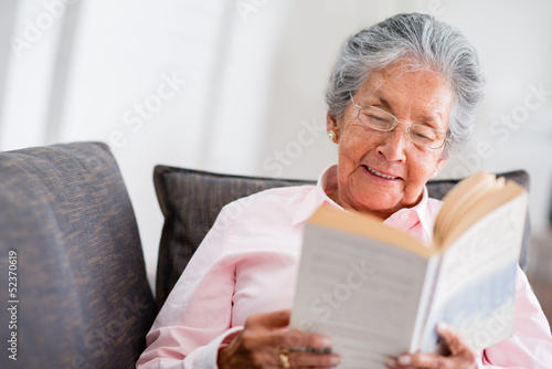 Photo: Elder woman reading a book Elder woman reading a book