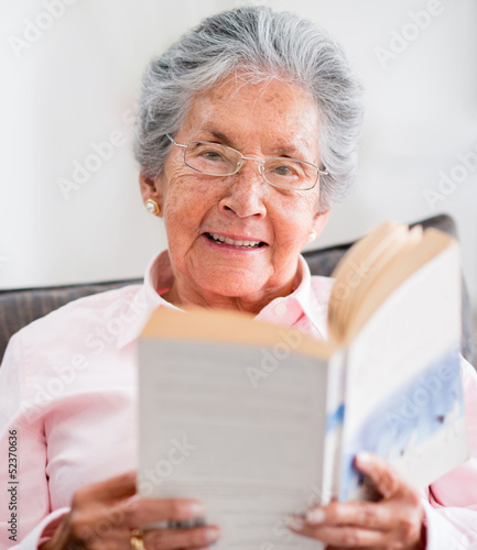 Photo: Retired woman reading a book Retired woman reading a book