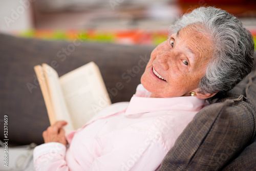 Photo: Senior woman reading a book Senior woman reading a book
