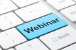 Education concept: Webinar on computer keyboard background