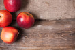 red apples on wooden background