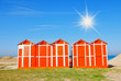 wooden cabins on the sand in rimini, italy