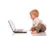 Young boy looking at a laptop