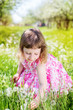 child girl at dandelion meadow in summer
