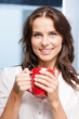 smiling woman with red cup