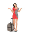 Foto: doubting woman with suitcase doubting woman with suitcase