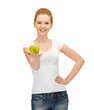 woman in blank t-shirt eating green apple