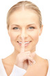 woman with finger on her lips