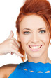 woman making a call me gesture