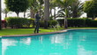 Video: Angry businessman walking with cellphone by the poolside Angry businessman walking with cellphone by the poolside
