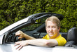 Mature man relaxing in convertible car