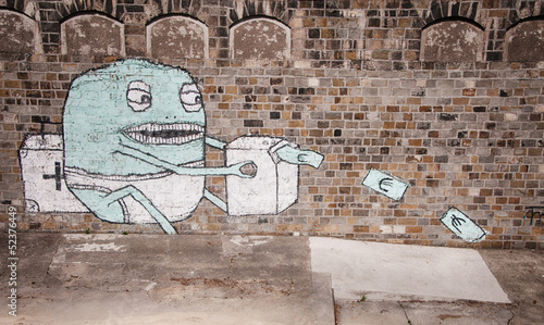 Photo: Graffiti in Vienna showing baby monster printing money Graffiti in Vienna showing baby monster printing money
