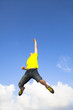 Photo: happy young man jumping with cloud background happy young man jumping with cloud background
