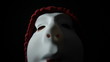 Crazy masked man over dark background