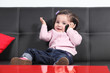 Casual baby playing happy with a mobile phone