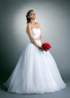 Beautiful slim bride posing in studio