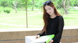 Asian women student looking profile in university and smiling