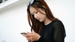 Close up beautiful young woman using a touch screen pad