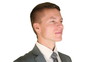 Businessman getting in focus, turns and smile, against white