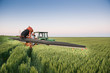 Tractor spraying on the field
