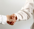 Closeup of a business handshake, isolated on white