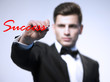 Business handsome man writing success graph