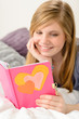 Young girl reading her journal of memories
