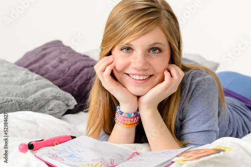 Photo: Dreamy girl dreaming about love over diary Dreamy girl dreaming about love over diary