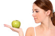 Photo: A portrait of beautiful young woman with a green apple A portrait of beautiful young woman with a green apple