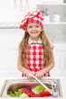Foto: Little chef washing vegetables Little chef washing vegetables