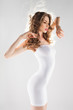 beautiful woman with perfect body in white modeling dress