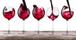 red wine set on a vintage wooden table