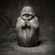 laughing buddha rocky sculpture