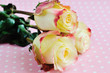 Three yellow-orange roses