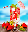 Summer drink with blur beach on background