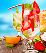 Summer drinks with blur beach on background