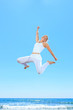Photo: woman jumping on the beach woman jumping on the beach