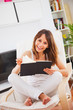 Young woman  reading a book in the room