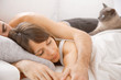 Portrait of a young couple sleeping on bed