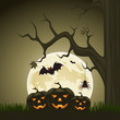 Vector: Halloween background with pumpkins and moon in the back Halloween background with pumpkins and moon in the back