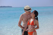 happy young couple have fun on beach