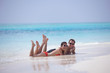 happy young couple have fun on beach