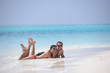 happy young couple have fun on beach