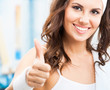 Photo: Woman showing thumbs up gesture Woman showing thumbs up gesture